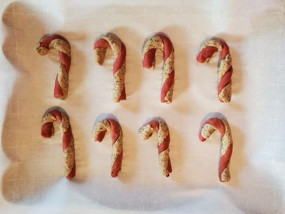 Candy cane shaped dog treats ready for the oven.