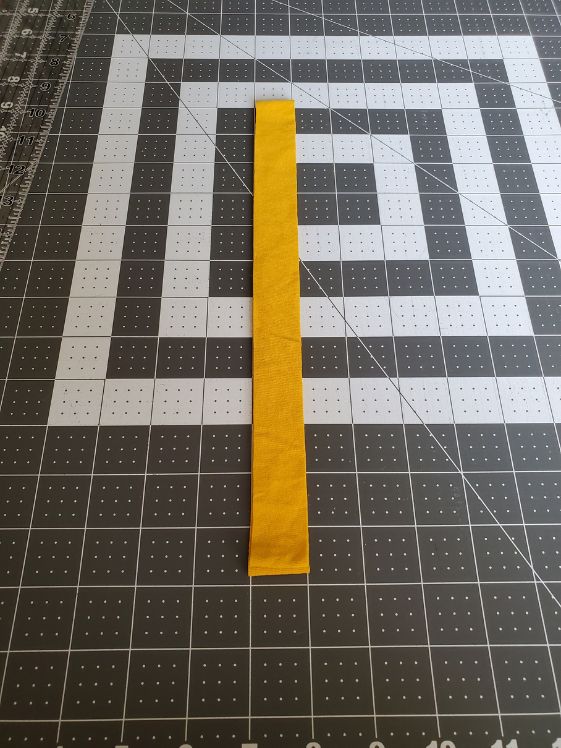 A strip cut from a t-shirt at 1 inch wide.