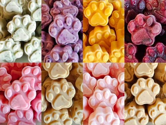 A collage of 8 different paw shaped frozen dog treats.
