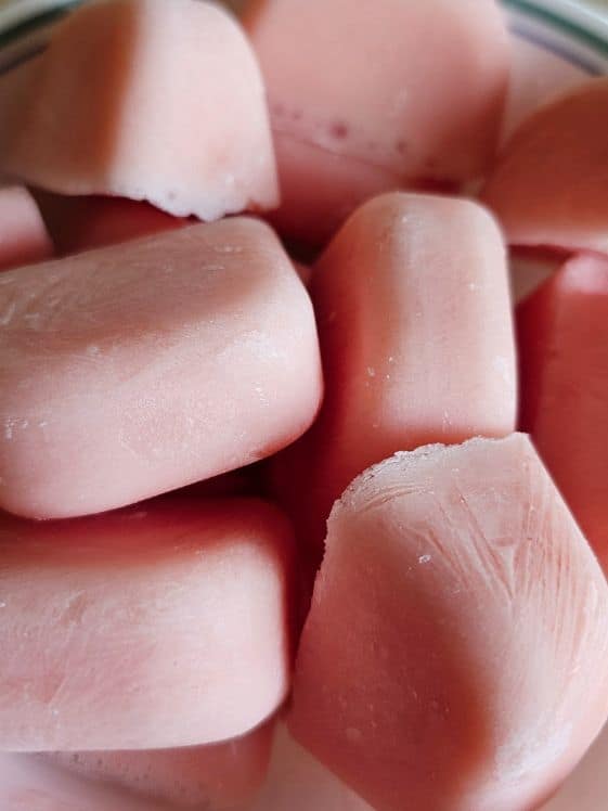 Ice cube shaped watermelon yogurt frozen dog treats.