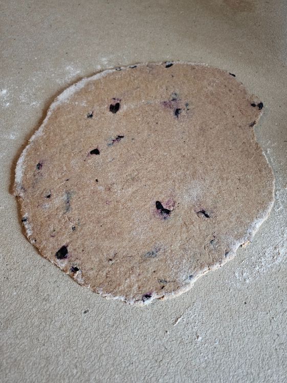 The dough rolled out ready to be cut.