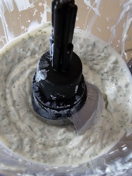 Ingredients for mint dog treats mixed together in a food processor.
