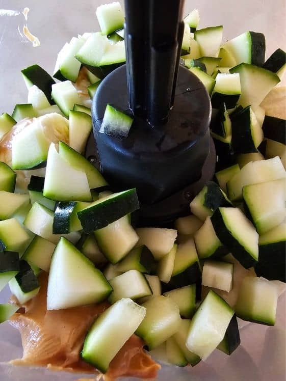 Zucchini, peanut butter, and banana in a food processor.