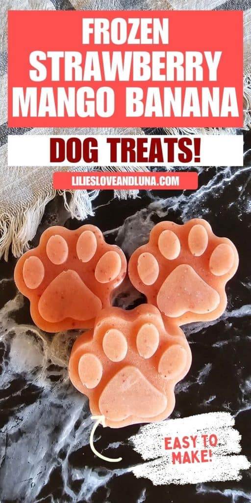 Frozen strawberry mango banana dog treats are shaped like paw prints and are displayed on a textured surface, promoting homemade cold treats for dogs.