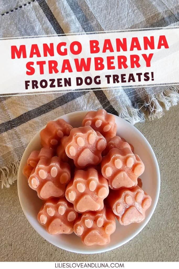 A bowl of paw-shaped mango banana frozen dog treats sits on a countertop, promoting a homemade recipe for healthy dog snacks.