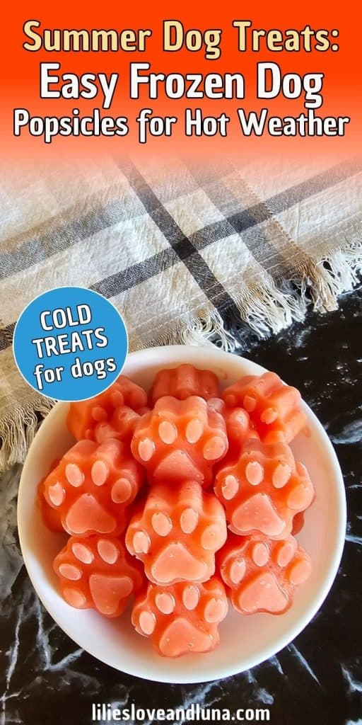 A bowl of paw-shaped frozen dog treats appears on a black surface, with the treats featuring a pink color, indicating they may be strawberry-flavored, and labeled as "easy homemade dog treats" suitable for hot weather.