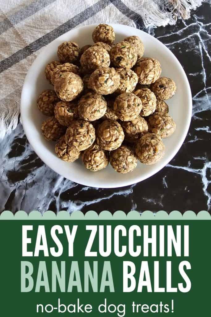 A white plate filled with homemade no-bake zucchini and banana balls, designed as easy and healthy dog treats, sits on a marble surface.